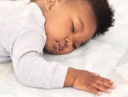 Baby sleeping on her stomach