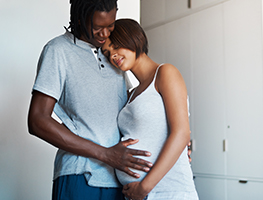 Man holding his pregnant partner